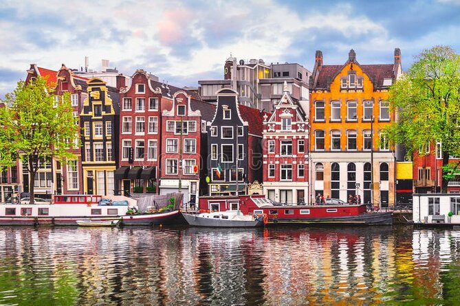 5 hrs Golden Age Amsterdam Private Walking Tour With Local Guide - From Singel to guild power: Kleinste Huis, De Waag, and a secret church
