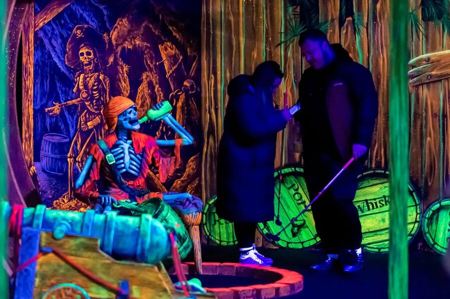 Aloha Amsterdam: 12-Hole Glow-in-the-Dark Mini-Golf - Pirates, ships, and underwater holes under UV light