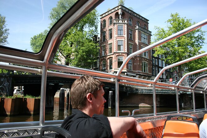 Amsterdam 1h Canal Cruise by Semi-Open Boat with Audio Guide - Semi-open boat views: what it feels like on the water