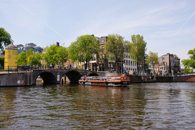 Amsterdam 1h Canal Cruise by Semi-Open Boat with Audio Guide - Merchant houses and gables: what to look for during the narration