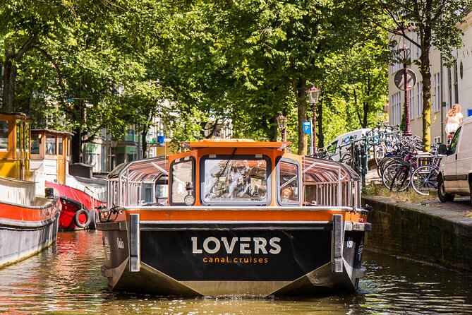 Amsterdam 1h Canal Cruise by Semi-Open Boat with Audio Guide - Crowds, sound issues, and the small practical headaches