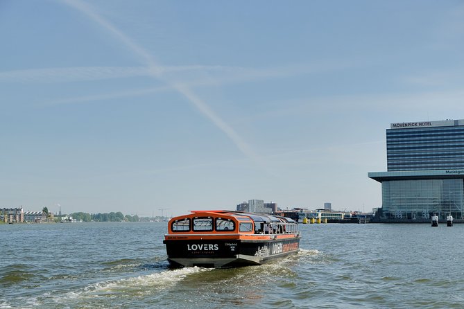 Amsterdam 1h Canal Cruise by Semi-Open Boat with Audio Guide - Who should book this 1-hour Amsterdam canal cruise