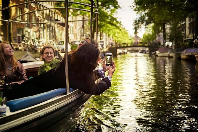 Amsterdam 2-hour Private Canal Cruise with Live Guide and Drinks - Meet at Prinsengracht 375, then settle in for the quiet start