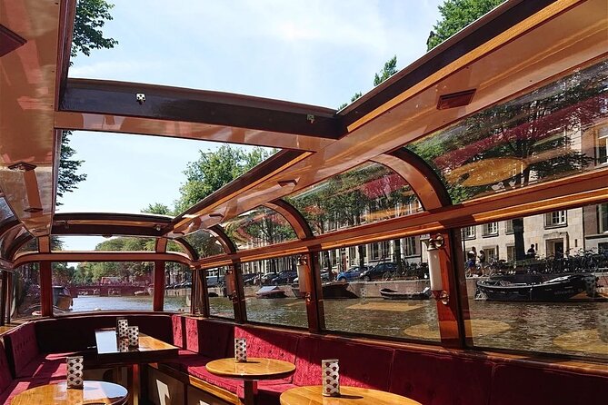 Amsterdam 2 Hour Small-Group Canal Cruise with Dutch Snacks & Bar - Amstel River into Magere Brug: romantic photos with a calmer pace
