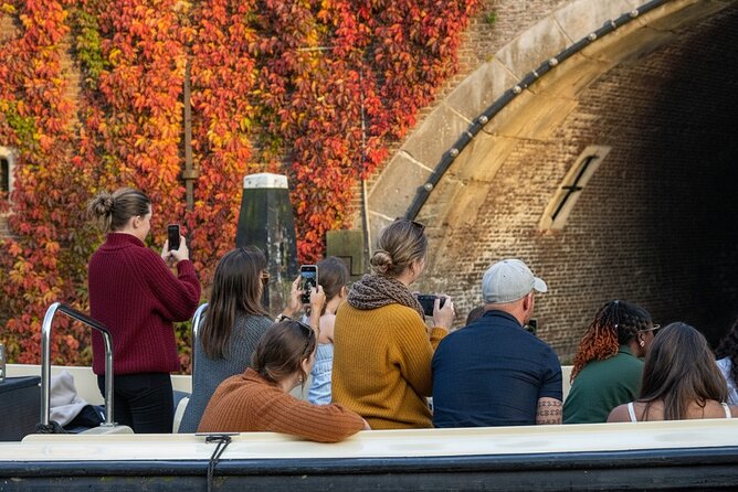 Amsterdam 90 minutes Canal Cruise with bar and snacks on board. - Amstel river scenes: churches, museums, and the Stopera feel