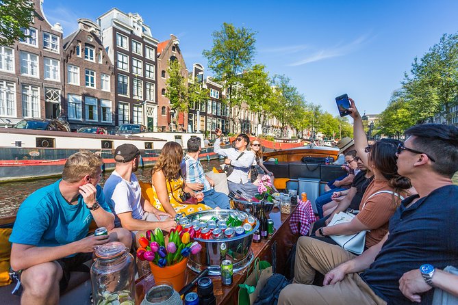 Amsterdam All-Inclusive 90-Minutes Heated Cruise by Captain Jack - Unlimited drinks and Dutch snacks, with an educational tone