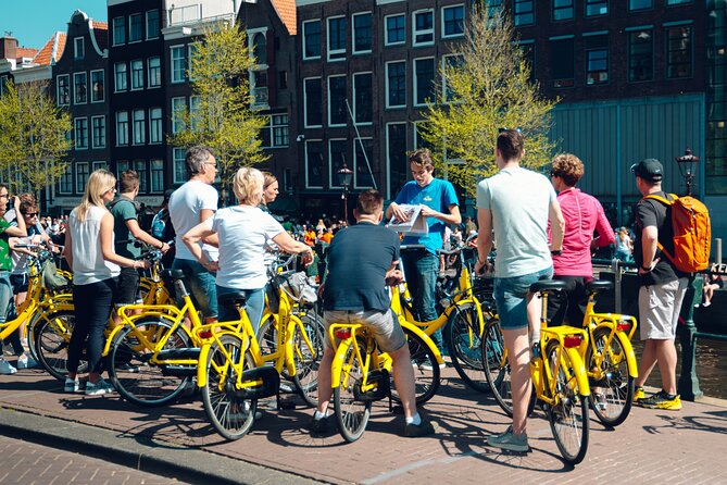 Amsterdam Anne Frank and Jewish History E Bike Tour - Starting at Nieuwezijds Kolk, the story opens fast