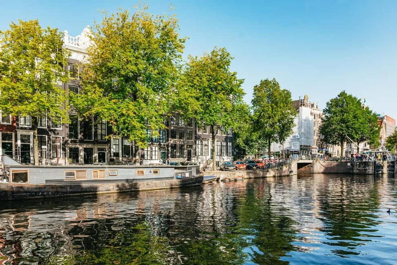 Amsterdam Bike Tour in Small Group + Optional Canal Cruise - De Gooyer windmill and the working-city vibe