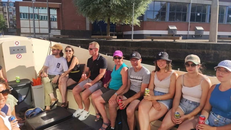 Amsterdam bike tour with a French-speaking guide local! - Dam Square and Westerkerk: Big Landmarks, Real Context