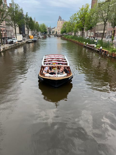 Amsterdam: Boat Tour with Optional Unlimited Drinks - Onboard comfort: open deck views, glass roof, and the disco mood lighting