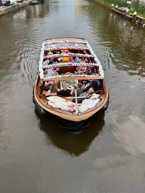 Amsterdam: Boat Tour with Optional Unlimited Drinks - Sea Palace, Grand Hotel Amrâth, towers and the Rembrandt stretch