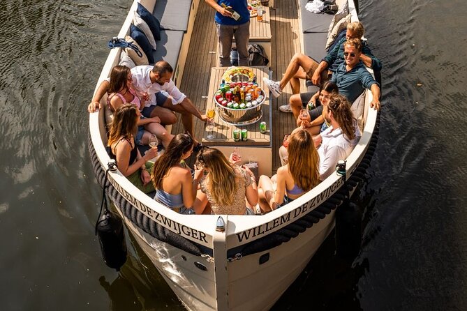 Amsterdam: Canal Booze Cruise with Unlimited Drinks Option - One hour of Amsterdam views, with an open-bar twist