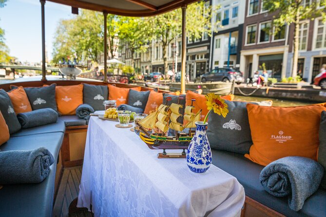 Amsterdam Canal Cruise in Classic Salon Boat With Drinks and Cheese - Stop 1 Amsterdam: what the 1-hour canal experience really feels like