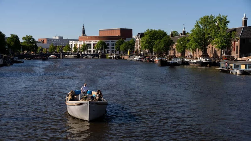 Amsterdam: Canal Cruise in Open Boat with Drink Option - Should You Book This KINboat 1-Hour Canal Cruise?