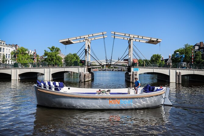 Amsterdam Canal Cruise in Open Boat with Unlimited Drinks Option - Passing Hermitage Museum and Gliding Through UNESCO Canals
