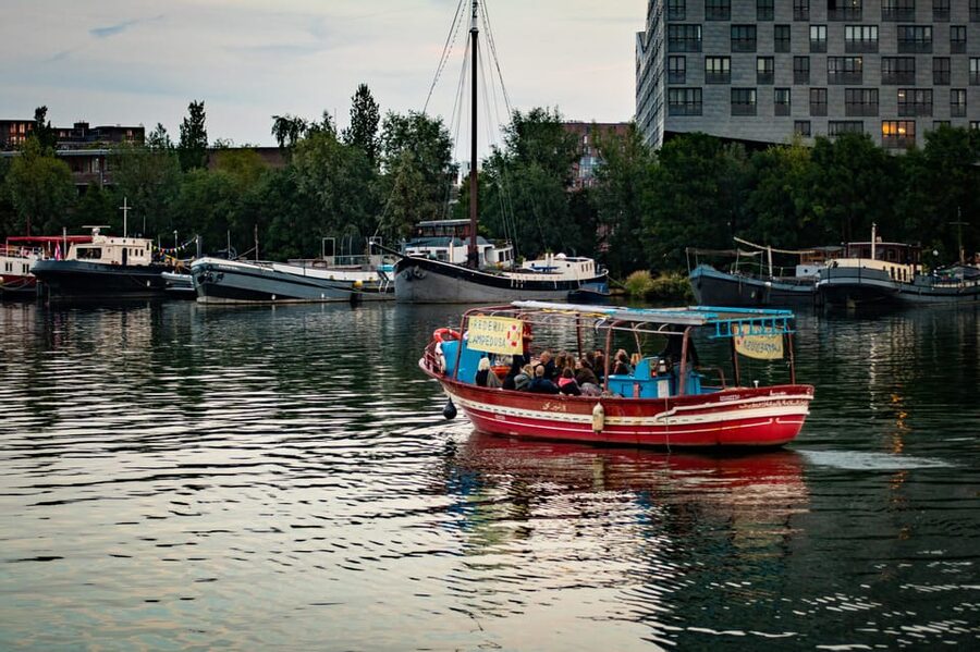 Amsterdam: Canal Cruise on a Wooden Refugee Boat - The 90-Minute Sail: Canals and the Amstel River