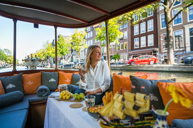 Amsterdam Canal Cruise with Cheese and Wine - Singing to the Waters: Singel Canal, Flower Market, and Canal Museums