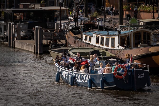 Amsterdam Canal Cruise with Live guide & Two drinks - Central St. - The Old City Centre route: small canals, landmarks, and the red-light district area
