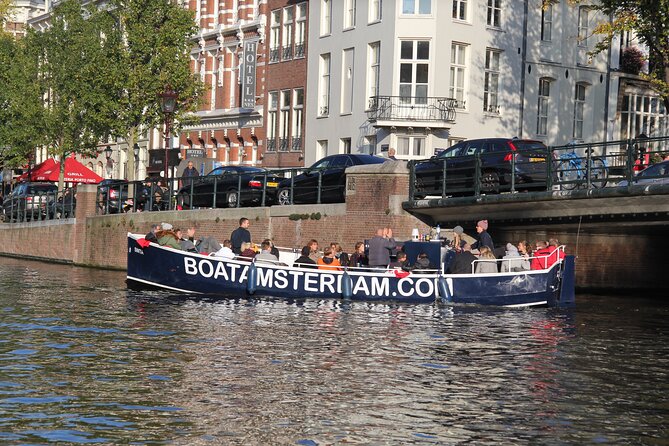 Amsterdam Canal Cruise with Open Bar - Central Station - Opera, towers, and coin-and-market landmarks you spot while cruising