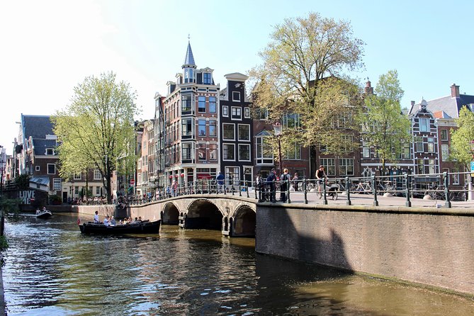 Amsterdam Canal Tour by Open Boat – 90 min Small Group Experience - Nieuwmarkt to Geldersekade: de Waag and the canal belt’s gatekeeping past
