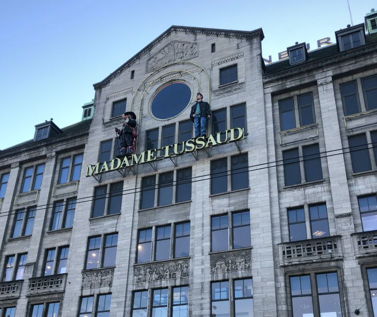 Amsterdam: City Center Walking Tour in italian - Dam Square to the Royal heart: quick stops, better context