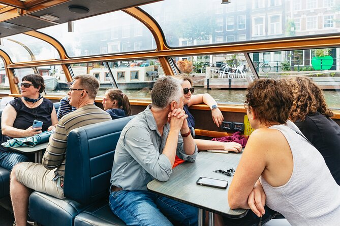 Amsterdam City Centre Cruise on heated boat with Audioguide - Boarding in Central Amsterdam, with Options That Actually Help