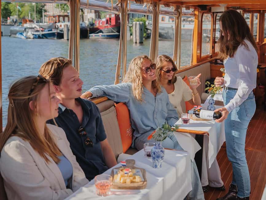 Amsterdam: Classic Saloon Boat Cruise with Cheese & Wine - Finding the right departure point around the canal belt