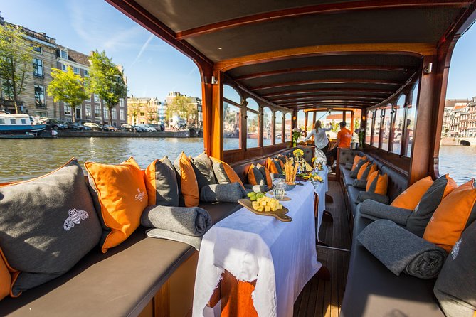 Amsterdam Classic Saloon Boat Cruise with Drinks and Cheese - How the Hour Flows: The Guide’s Job Is Making the Canals Readable