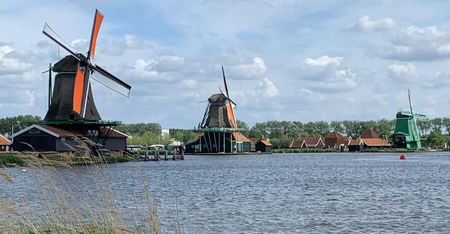 Amsterdam: Countryside Bike Tour and Zaanse Schans Windmills - Zaanse Schans: one windmill visit, clogs made, and Gouda time