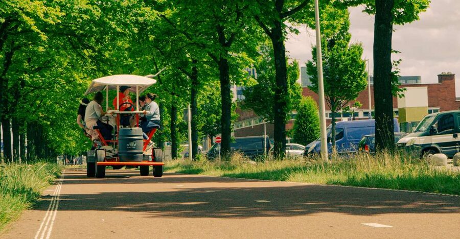 Amsterdam: Dutch Beer Bike Blast Tour with Onboard Bar - Cycling through Sloterdijk: industrial views, good motion, and group energy