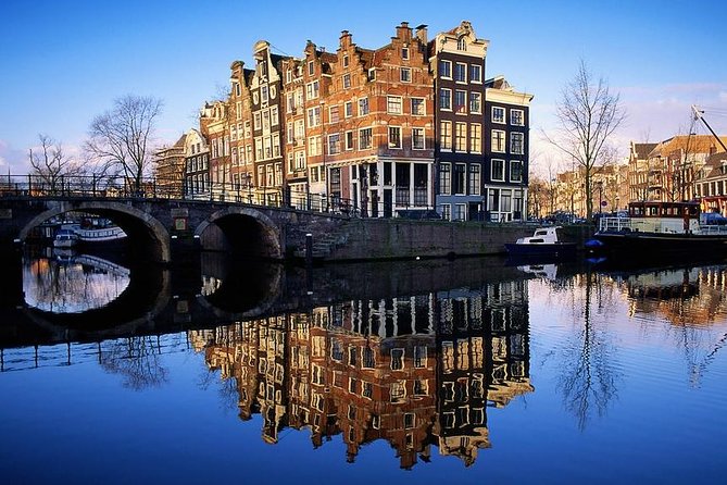 Amsterdam: E-Bike Sightseeing Tour - Bloemenmarkt flower market: color breaks between landmarks