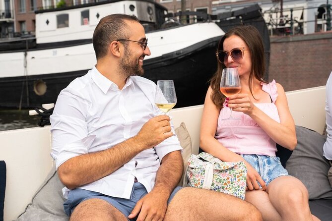 Amsterdam: Evening Candle Light Cruise With Wine & Cheese - Floating Amsterdam meeting point, and how to avoid the wrong boat