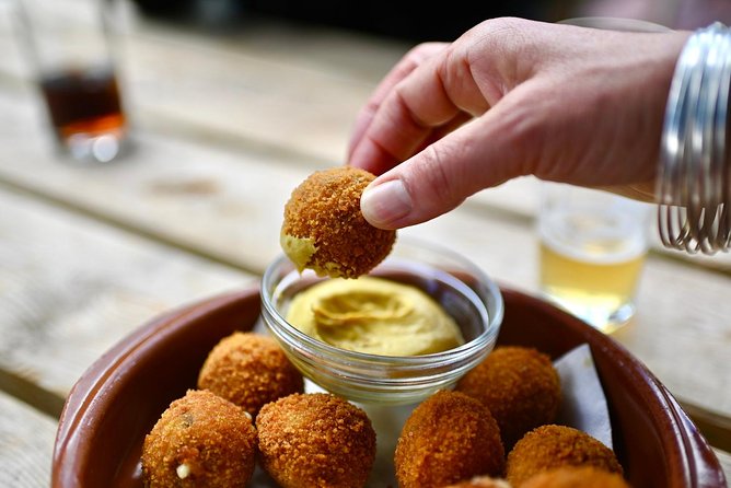 Amsterdam Food Tour of 10+ Local Classic Tastings in Jordaan Area - Cheese, hams, sausages, and the Dutch salty middle