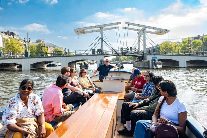 Amsterdam: Guided City Highlights Open Boat Canal Cruise - Getting to Stadhouderskade 501, then setting off near Hard Rock Cafe