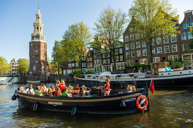 Amsterdam: Guided Open Boat Canal Cruise Unlimited Drinks Option - Why an open-boat canal cruise works so well in Amsterdam