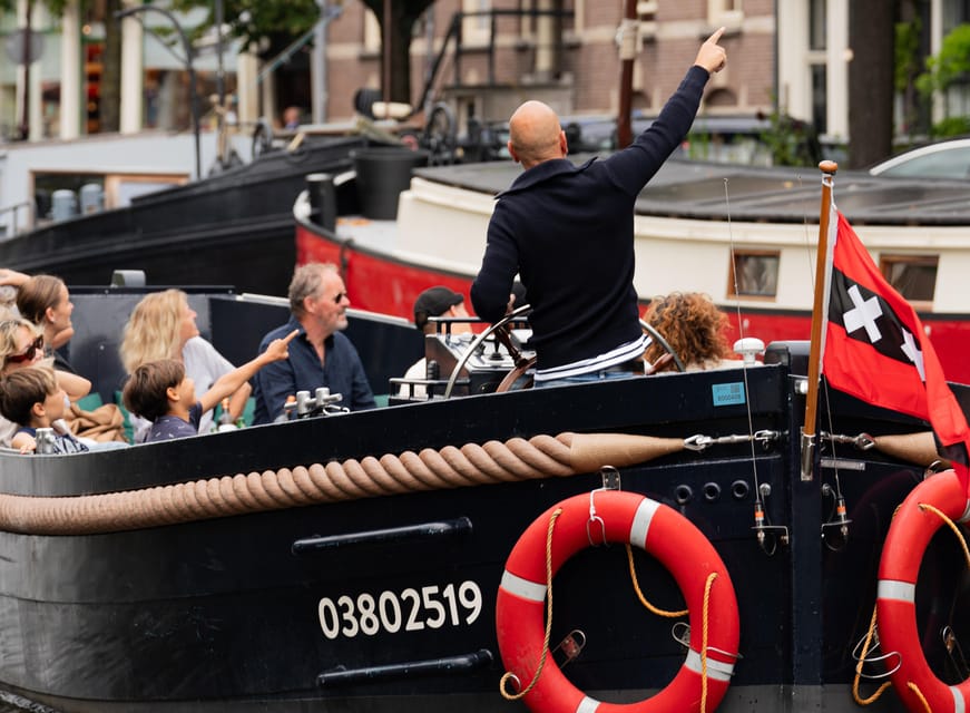Amsterdam: Guided Open Boat Cruise Unlimited Drinks Option - Unlimited drinks option: fun value for some, questionable for others