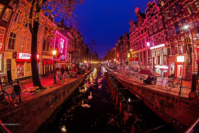 Amsterdam: Guided Red Light District and City Walking Tour - Near the Dam area, the city’s wooden-pole engineering story