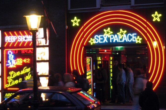 Amsterdam: Guided Red Light District and City Walking Tour - The smallest house, plus the VOC trade angle