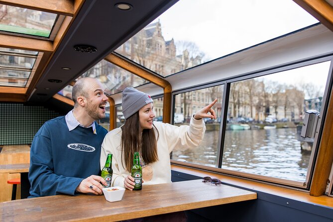 Amsterdam Heineken Cruise with 1 Heineken, Snacks, Live Guide - A 45-minute Heineken cruise that actually fits your day