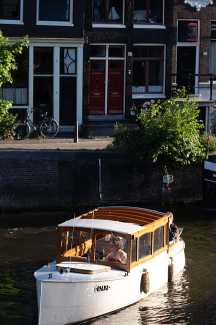 Amsterdam: Hidden Gems Canal Cruise - Polaroid keepsake and cozy touches that make it feel personal