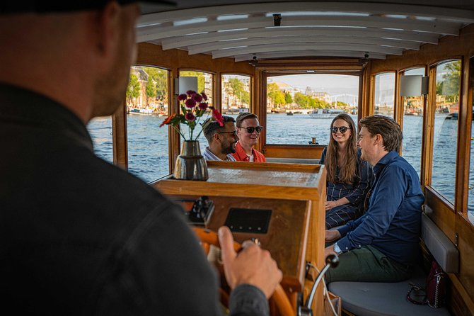 Amsterdam Highlights Canal Cruise with a Drink - Chilled wine plus a private boat is the right kind of first day