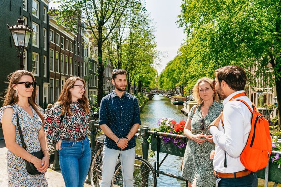 Amsterdam: Historical Highlights Walking Tour with Tasting - UNESCO Canal District: canals, bridges, and locks you will actually understand
