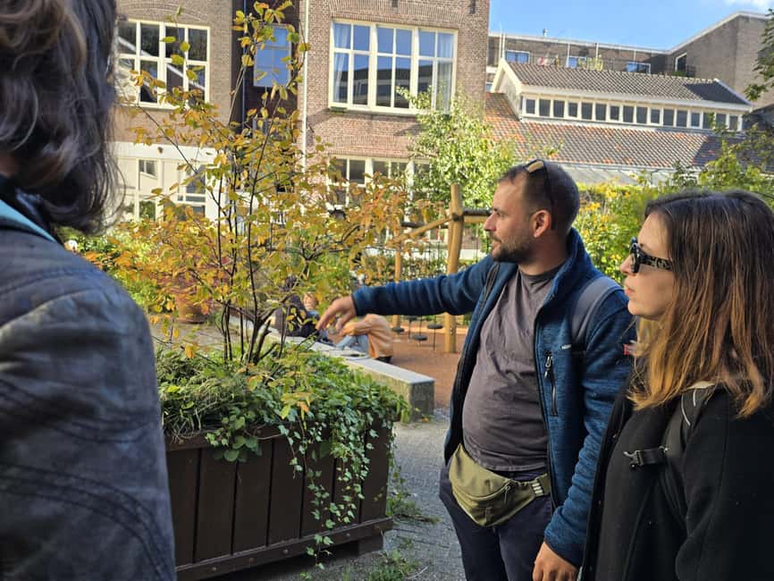 Amsterdam: History, Hidden Gems & Future Eco-Walking Tour - From WWII resilience to 1970s culture: a timeline with a point
