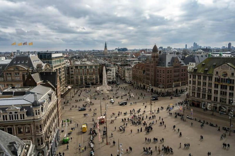 Amsterdam: Iconic Canals & Historic Sights Walking Tour - Oude Kerk and the Red Light District: Old Stone in a Provocative Place