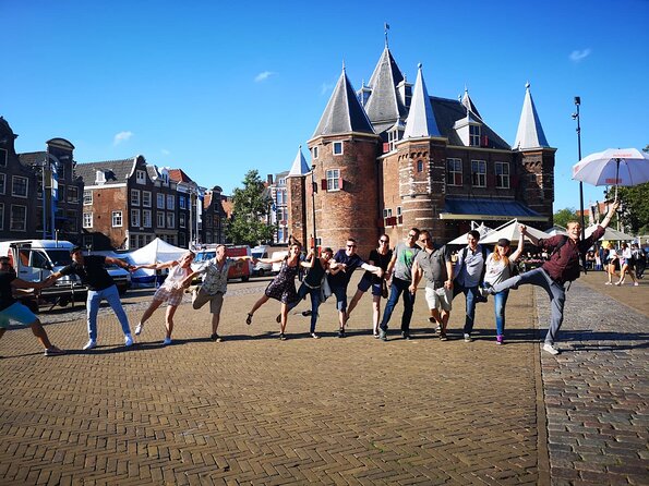 Amsterdam Introductory Walking Tour with a Local - Stop 1: Dam Square and the National Monument to Royal Palace Context