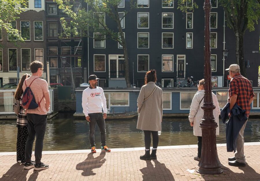 Amsterdam: Jewish Quarter and History Guided Tour - Entering the Jewish Quarter from the Amstel River