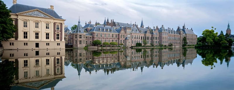 Amsterdam: Kinderdijk, Euromast, Delft and Den Haag Day Tour - Guides Make the Difference, Including Adrian and Simon