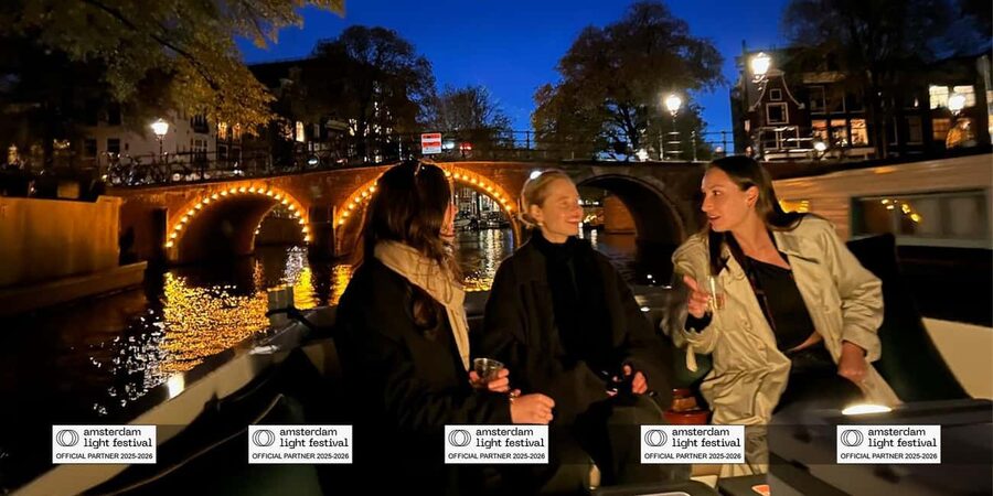 Amsterdam: Light Festival Boat+Unlimit.Drinks & Snack Option - Warmth and shelter: blankets, half-open boats, and hot drinks on winter canals
