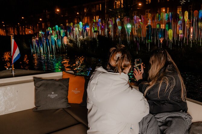 Amsterdam Light Festival: Canal Cruise + Bite & Unlimited Drinks - Open boat on dry nights, covered in rain: plan for visibility