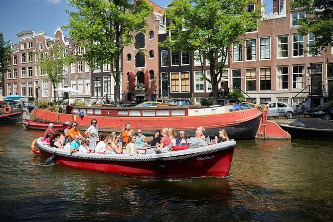 Amsterdam Light Festival: Saloon Boat Cruise + Hot Drinks & Bite - National Maritime Museum dock to Amsterdam’s night glow